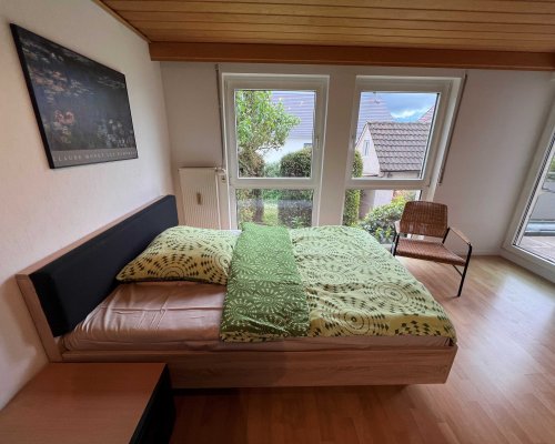 Gästezimmer mit Balkon